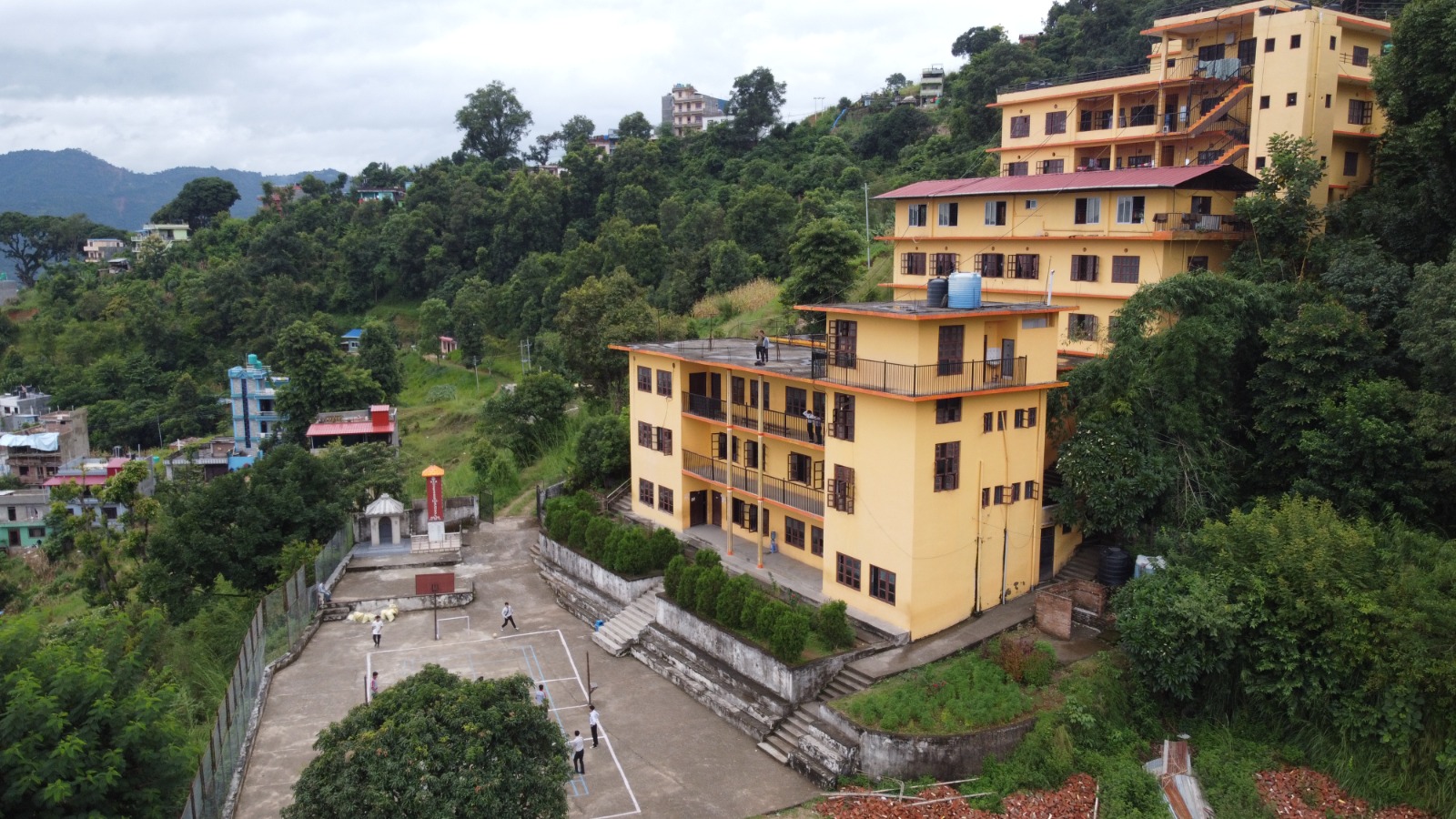 Aerial view of the school buildings and playground