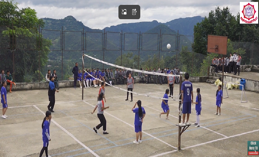 Students playing on the volleyball court